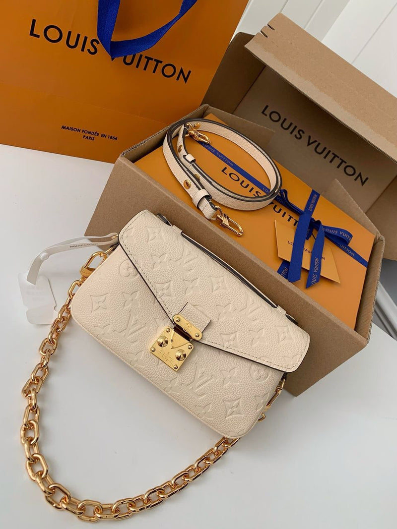 Pochette Métis East West Monogram Empreinte Cream
